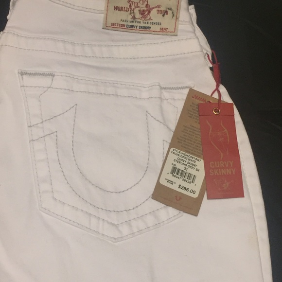 White True Religion jeans with silver accents