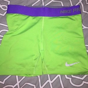 Green & purple Nike compression shorts