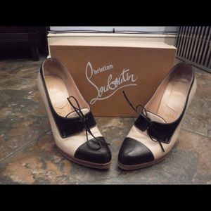 Christian Louboutin stacked spectator heels.