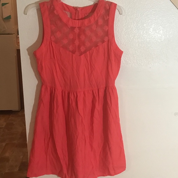 Coral sleeveless dress.