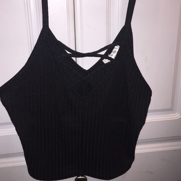 a black crop top with caging detail on the front