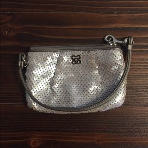Metallic silver wristlet.