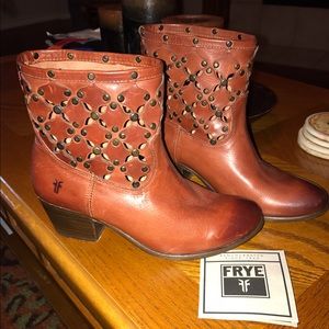 Brown Frye's leather cutout pattern booties.