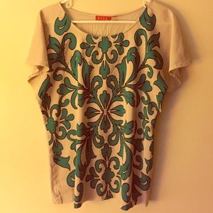 Tan and green designed blouse.