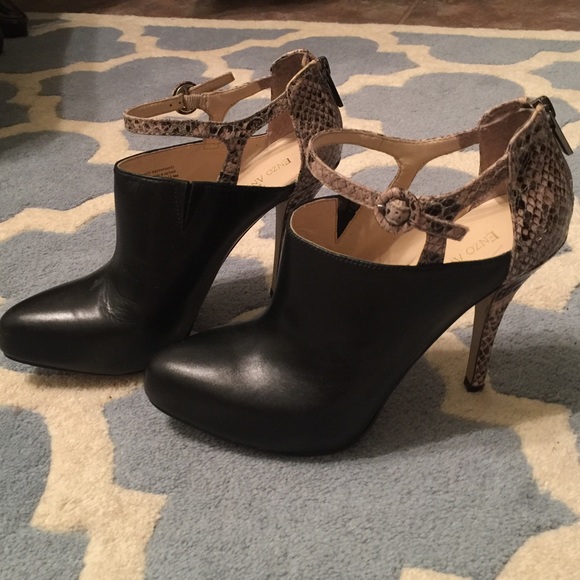 Black leather booties with python detail.