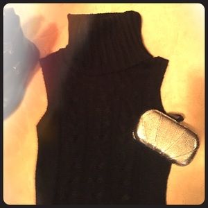 Black sleeveless turtleneck sweater