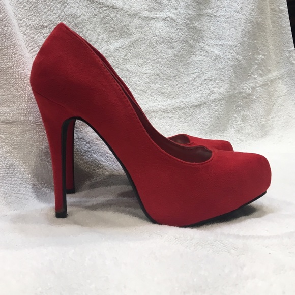 Red suede pumps