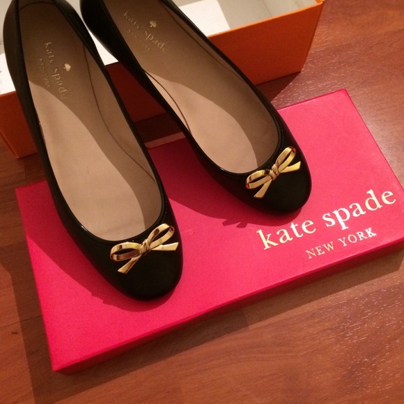 Black Kate Spade flats with gold bows