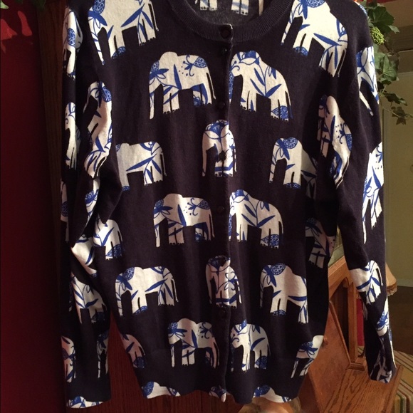 Blue and white sweater with elephants.