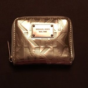 Micheal Kors rose gold bifold wallet
