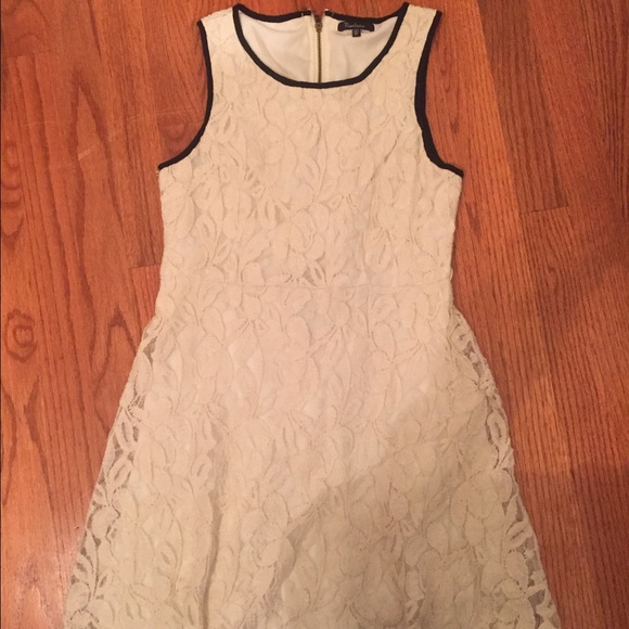 white lace dress with black trim! zips in the back