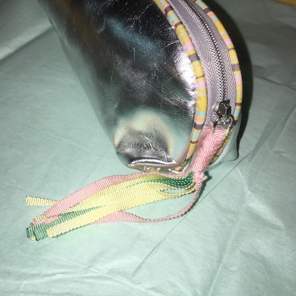 New silver cosmetic case with colorful tassel