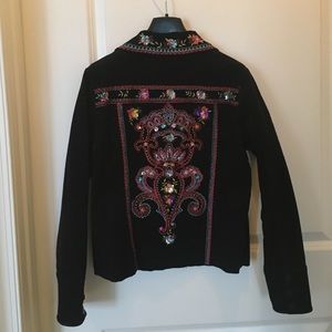Embroidered jacket in superfine black corduroy.