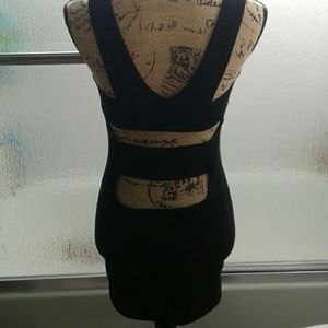 Tight, slightly open black dress