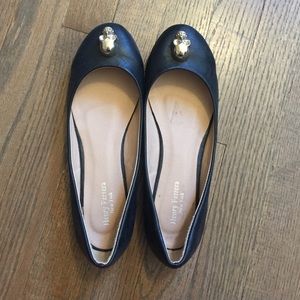 Black flats with gold skull