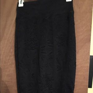 Thin black pencil skirt with floral design.