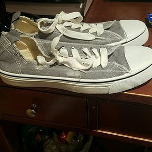 Grey "ripped" off brand converses