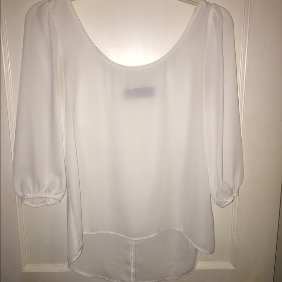 White top with bow on back