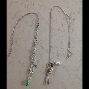 2 silver necklaces.