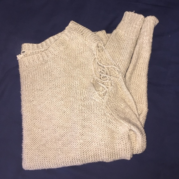 Sweater with ripped detailing on shoulders