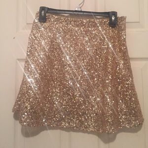 NWT gold sequin skirt. Size is large BUT isn't TTS