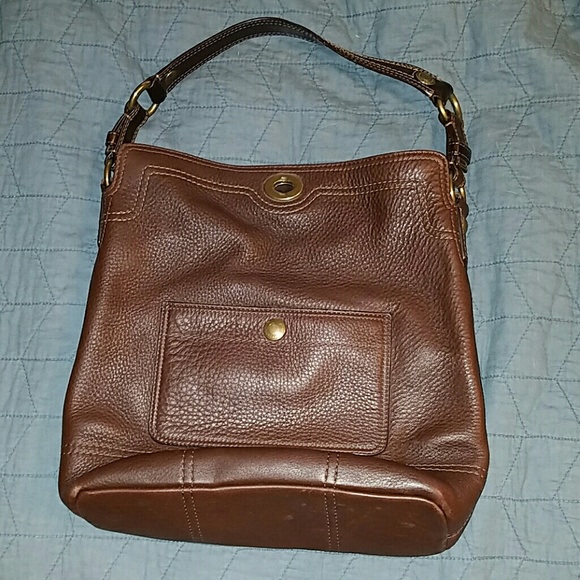 Brown Coach shoulder bag with turnlock closure