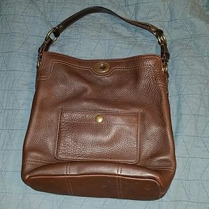Brown Coach shoulder bag with turnlock closure