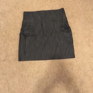 Black denim skirt with side rushing