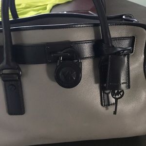 Slightly used Hamilton gray and black handbag.