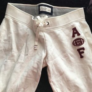 White and maroon sweatpants