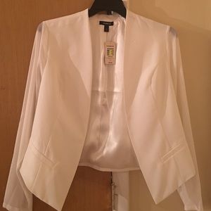 White Blazer with sheer sleeves.