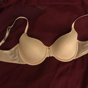Nude colored Jennifer Lopez bra
