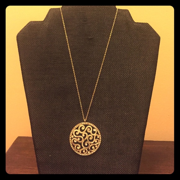 Rhinestone and silver medallion necklace.