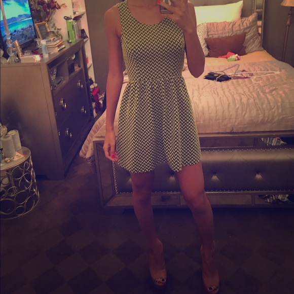 Green and black peplum style dress