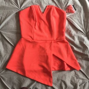 CORAL STRAPLESS ASYMMETRICAL PEPLUM TOP