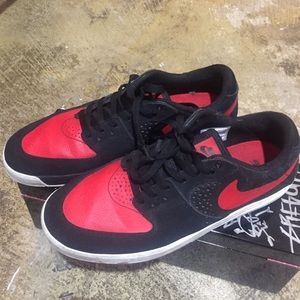 Red and black nike dunk low pro sb shoe