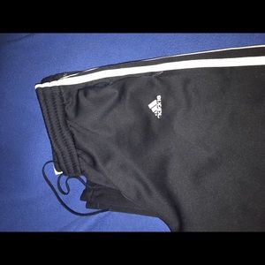 Adidas sweat pants.