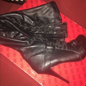 Over the knee tie up boots.