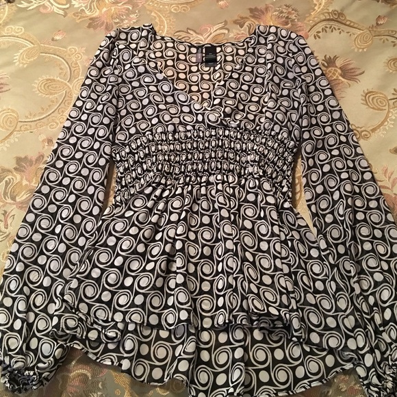 Sheer black and white blouse.