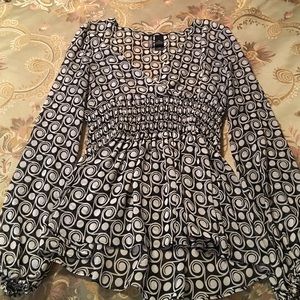 Sheer black and white blouse.