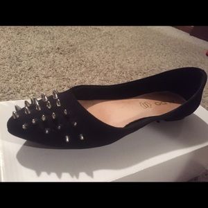 Black Aldo flats with silver spikes