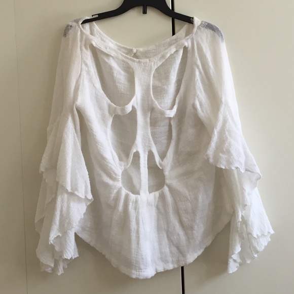 light & flowy top, caped arms & open back detail