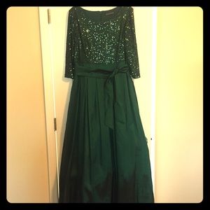 Emerald green floor length formal gown.
