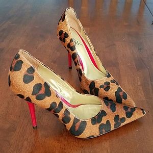 Carlos Leopard haircalf and red bottom pumps.