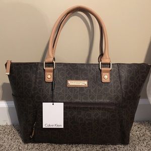 Brand new. I just don't need a new handbag.