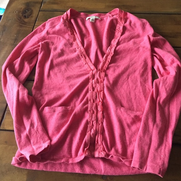 Coral sweater with clasp closures
