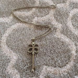 Arbonne silver necklace with key pendant.