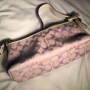 A very elegant lavender Coach handbag.
