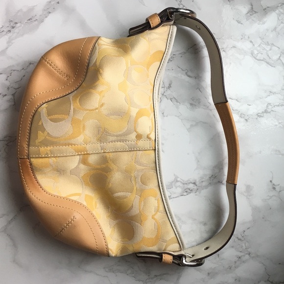 Small yellow and tan Coach Handbag