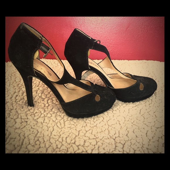 Black suede high heels.